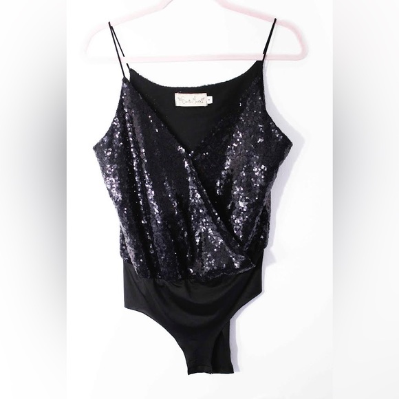 Santa Maria

Colombian brand
Sequin bodysuit in perfect condition - Picture 1 of 3